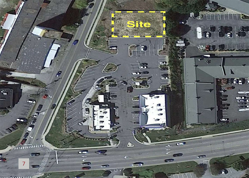Aerial view of the development parcel site with boundary shown in yellow